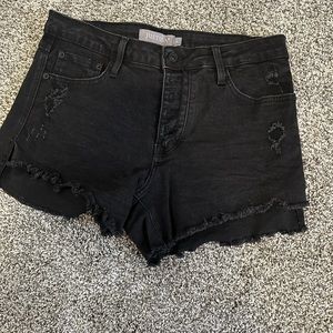 Black distressed Jean shorts. Size large.